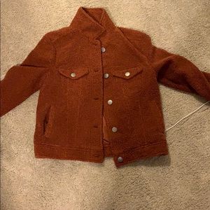 This is an orangy brown jacket.